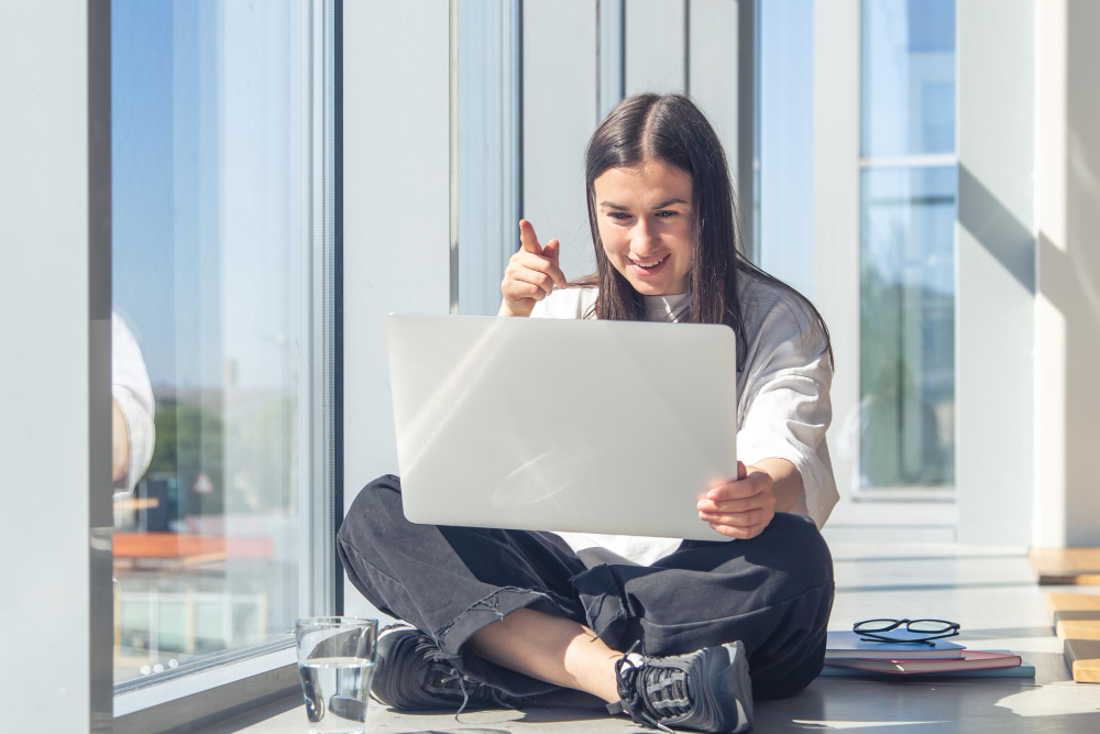 funny-young-woman-front-laptop-screen-office